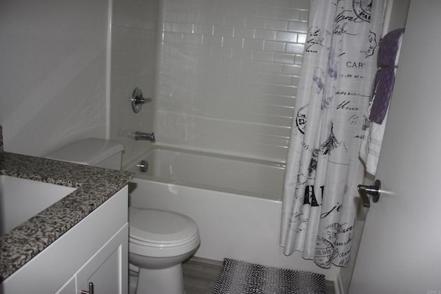 full bathroom with hardwood / wood-style floors, vanity, toilet, and shower / bath combo with shower curtain