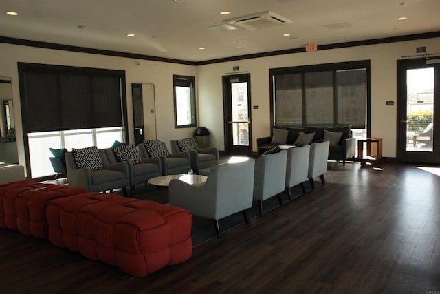 living room featuring dark hardwood / wood-style floors and ornamental molding