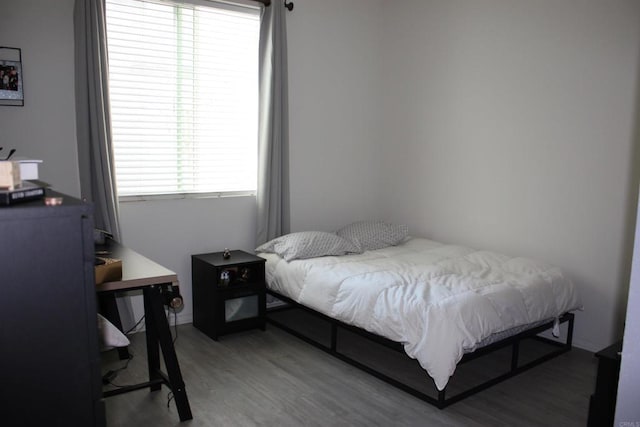 bedroom featuring wood-type flooring