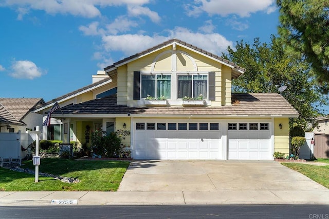 view of front of property with a front lawn and a garage