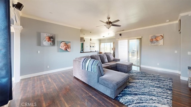 living room with crown molding, dark hardwood / wood-style floors, and ceiling fan