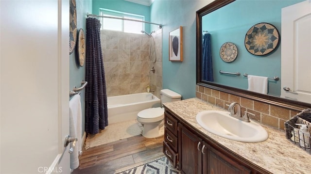 full bathroom with tasteful backsplash, wood-type flooring, toilet, vanity, and shower / bathtub combination with curtain