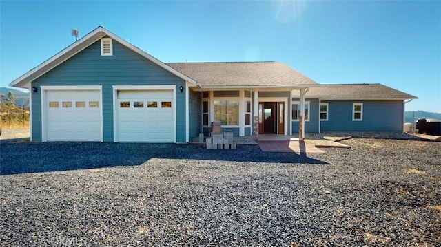 view of front of property with a garage