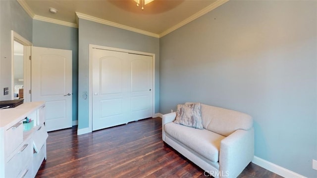 sitting room featuring crown molding, dark wood-type flooring, and ceiling fan