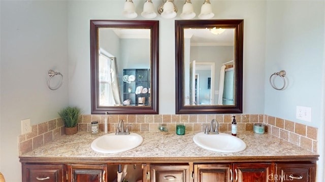 bathroom featuring vanity, ornamental molding, and decorative backsplash