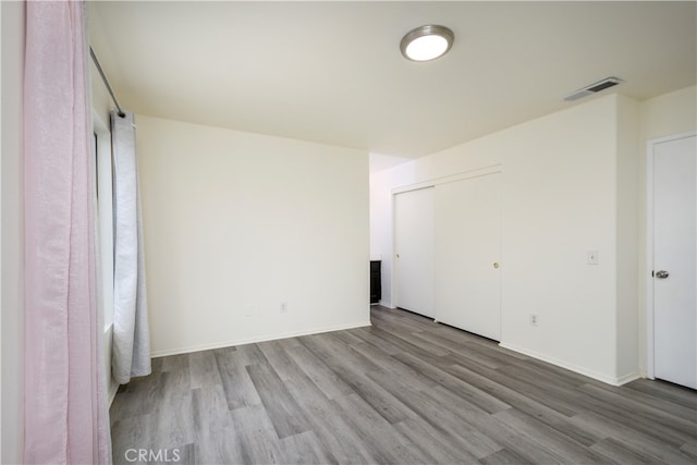 spare room with light hardwood / wood-style floors