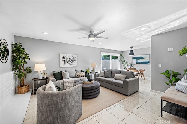 tiled living room with ceiling fan