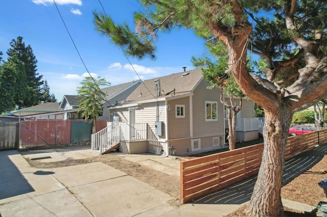 back of property with a patio