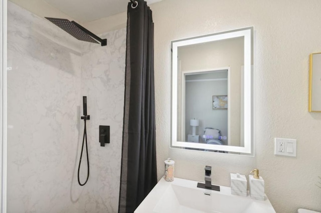 bathroom with vanity and curtained shower