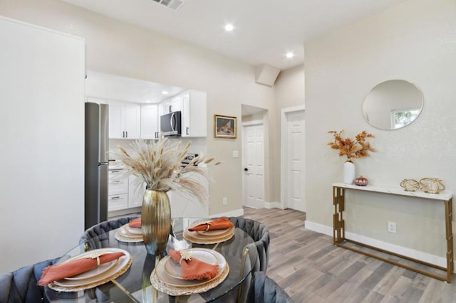 dining room featuring light hardwood / wood-style floors