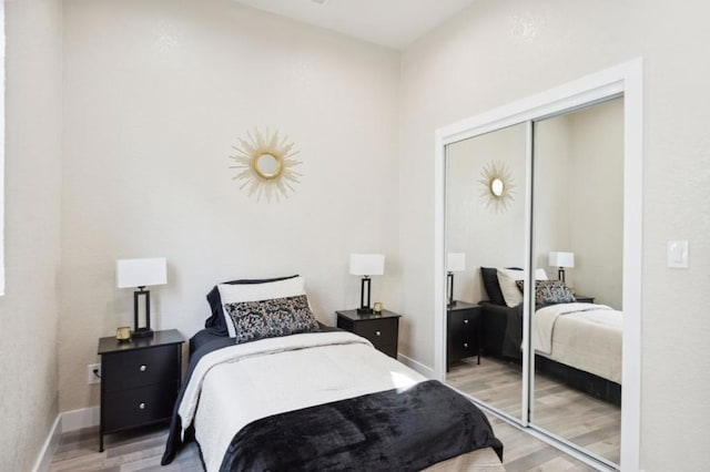 bedroom featuring a closet and wood-type flooring