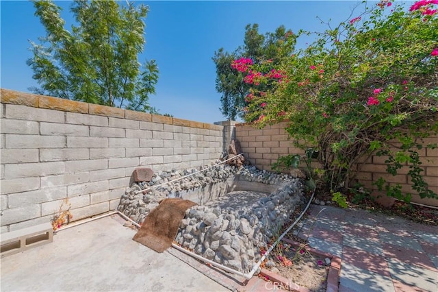 exterior space featuring a fenced backyard