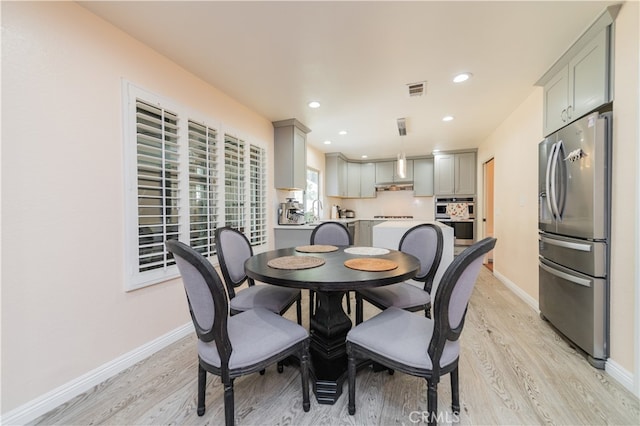 dining room with light hardwood / wood-style flooring