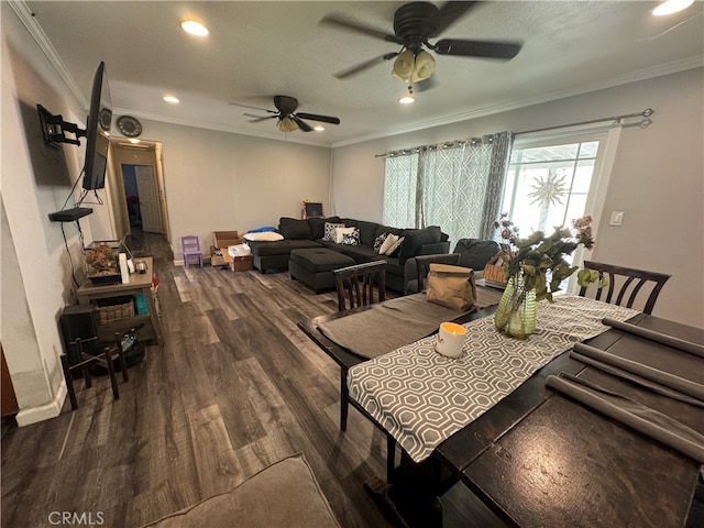 dining area with crown molding, dark hardwood / wood-style flooring, and ceiling fan