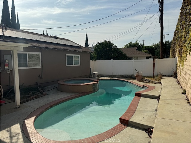 view of swimming pool featuring an in ground hot tub