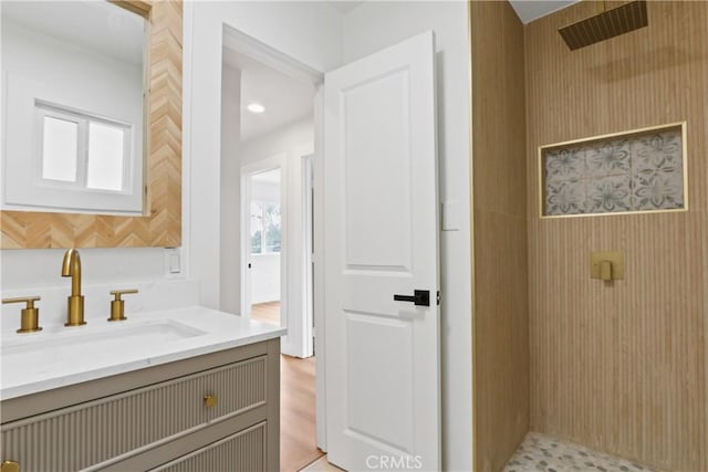 bathroom with vanity and walk in shower