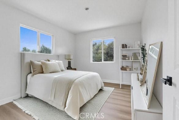 bedroom featuring light hardwood / wood-style floors