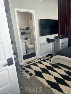 bedroom featuring connected bathroom