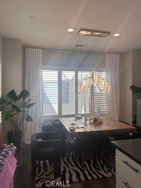 dining area with hardwood / wood-style floors