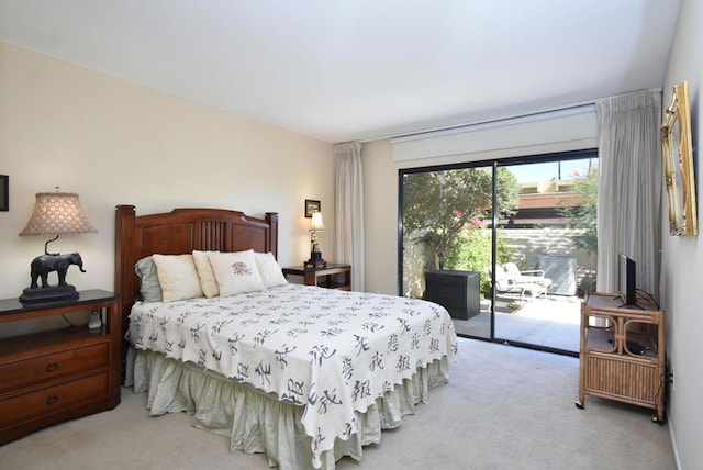 carpeted bedroom with access to exterior