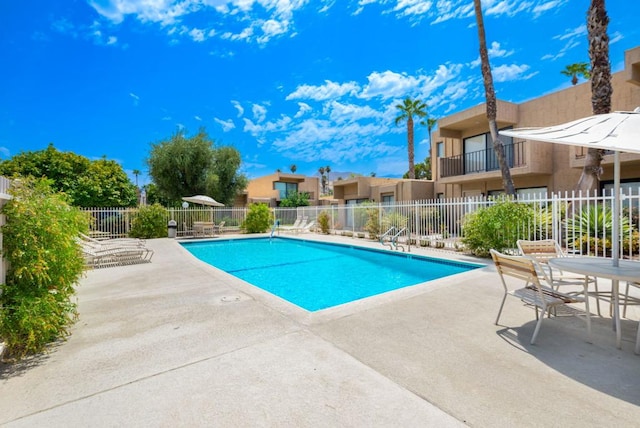 view of swimming pool featuring a patio area