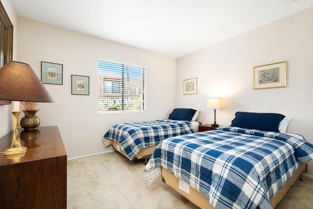 bedroom with light carpet