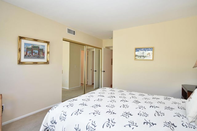 carpeted bedroom featuring a closet