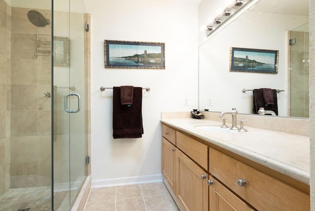 bathroom featuring tile patterned floors, vanity, and an enclosed shower