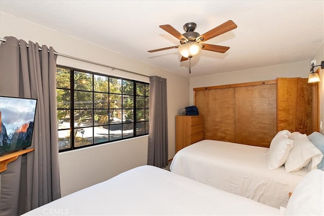 bedroom featuring a closet and ceiling fan