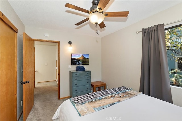 carpeted bedroom featuring ceiling fan