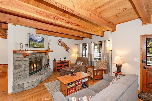 living room featuring a stone fireplace, wood ceiling, beamed ceiling, and light hardwood / wood-style floors