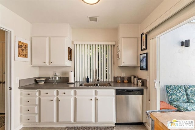 kitchen with white cabinetry, dishwasher, and sink