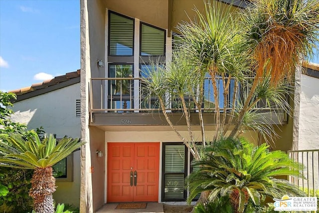 doorway to property featuring a balcony