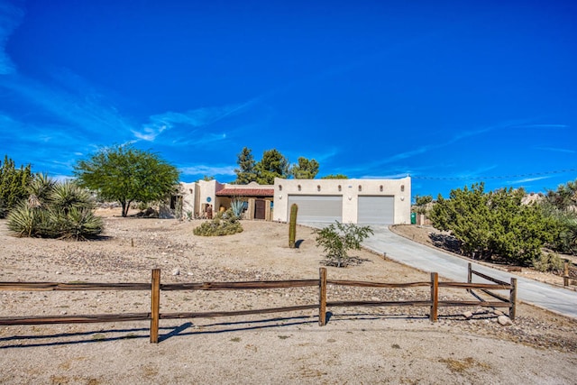 southwest-style home featuring a garage