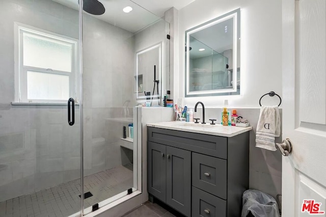 bathroom with vanity and walk in shower