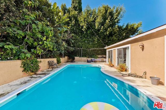 view of pool featuring a patio area