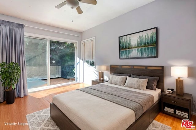 bedroom with access to exterior, light wood-type flooring, and ceiling fan