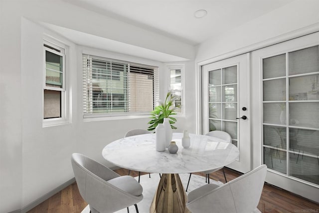 dining space featuring dark wood-type flooring