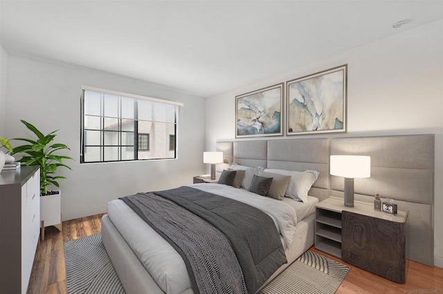 bedroom with hardwood / wood-style floors