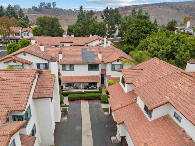 birds eye view of property featuring a mountain view