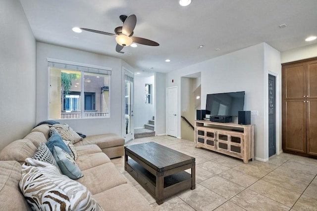 living room featuring ceiling fan and light tile patterned floors