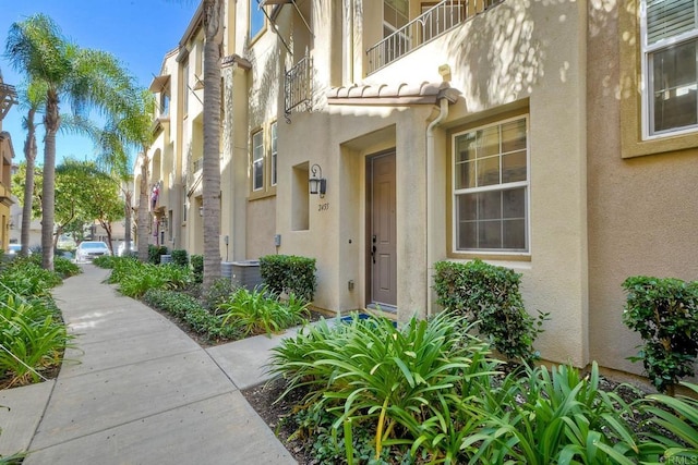 entrance to property with a balcony