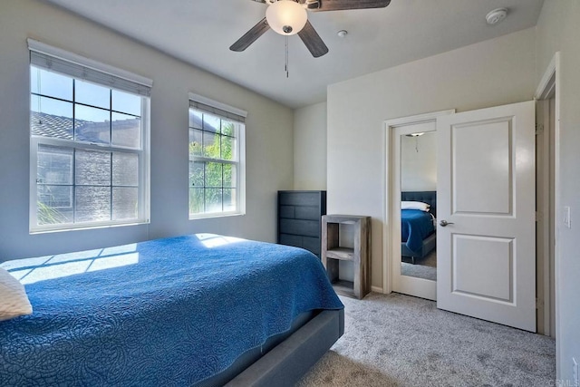 carpeted bedroom featuring ceiling fan