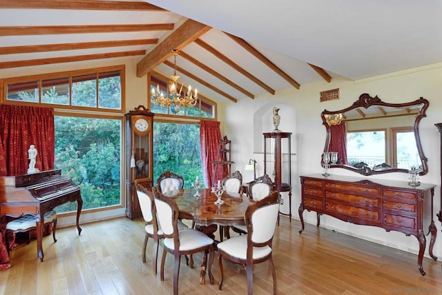 dining room featuring wood-type flooring, vaulted ceiling with beams, and an inviting chandelier