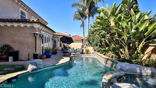 outdoor pool featuring a patio area