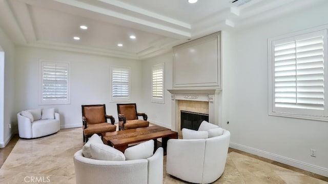 living room with a tile fireplace