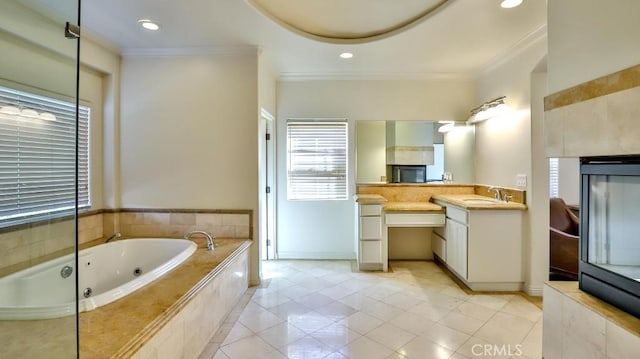 bathroom with vanity, tiled bath, tile patterned floors, and ornamental molding