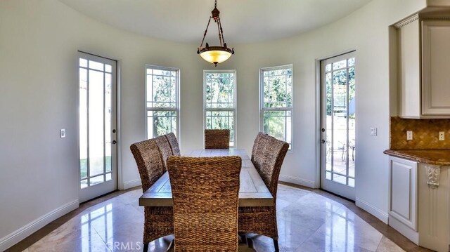 dining area featuring a wealth of natural light