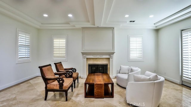 sitting room with a tile fireplace