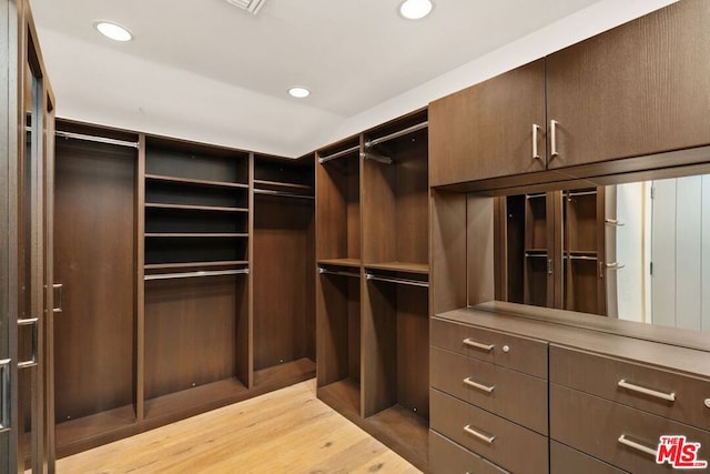 walk in closet featuring light wood-type flooring